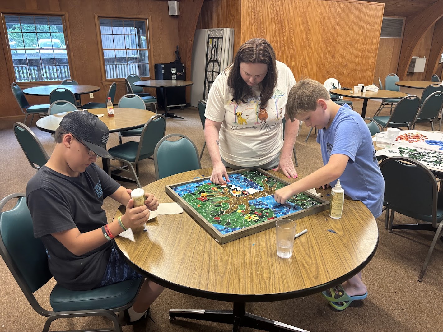 Family working on a mosaic